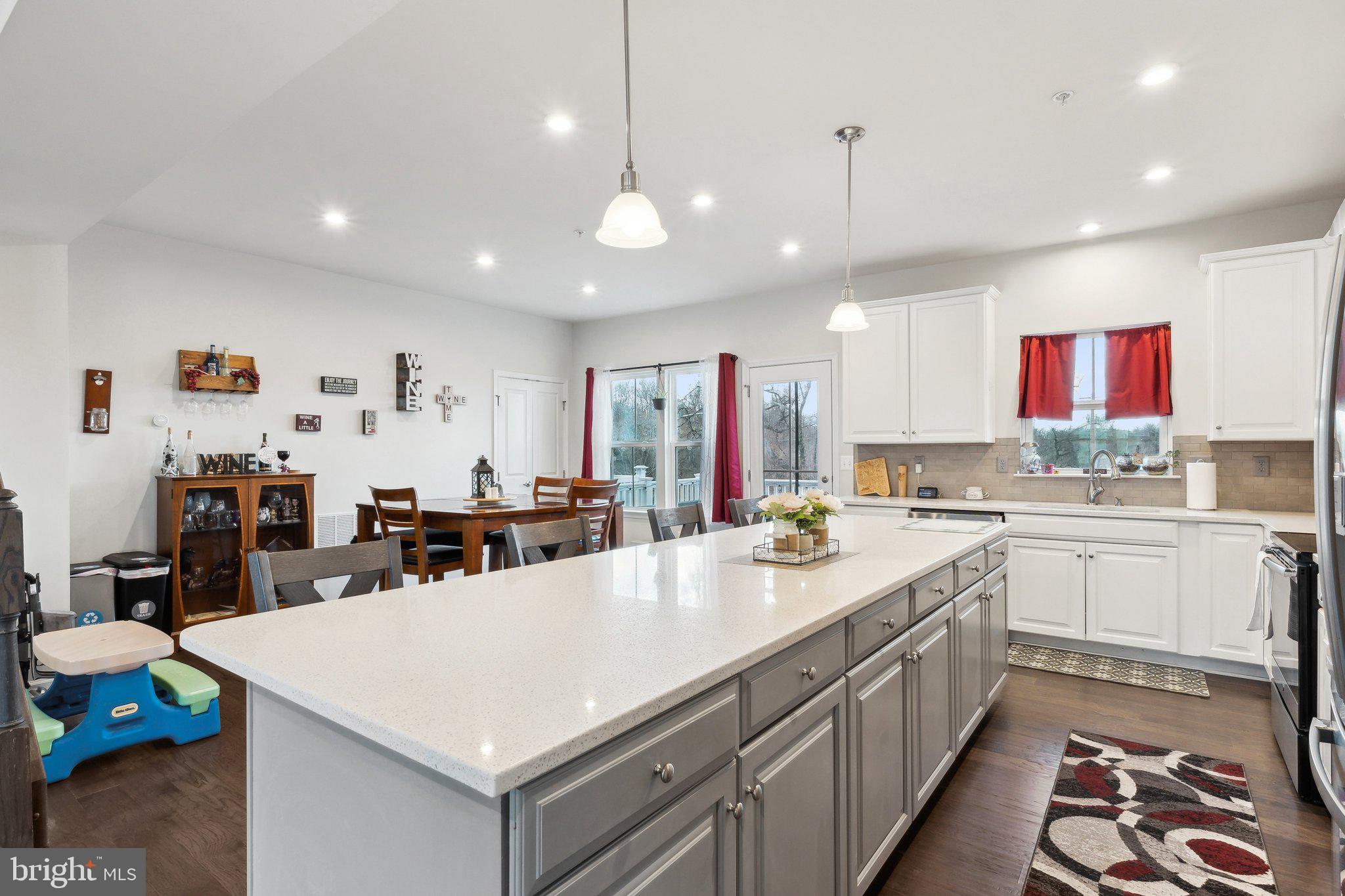 3012 Shaws Road Edgemere, MD 21219 - Photo 7 of 57 a view of a kitchen with kitchen island a sink appliances and a living room view