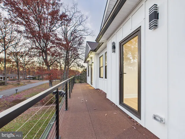 a large kitchen with kitchen island a sink stainless steel appliances and cabinets