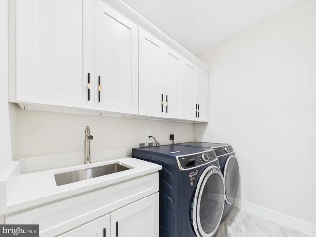 a kitchen with granite countertop a sink and a window
