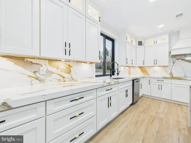a kitchen with a sink cabinets and counter space