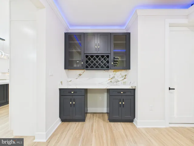a large bathroom with a double vanity sink a mirror and a bathtub