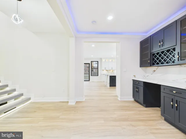 a bathroom with a tub sink shower and mirror