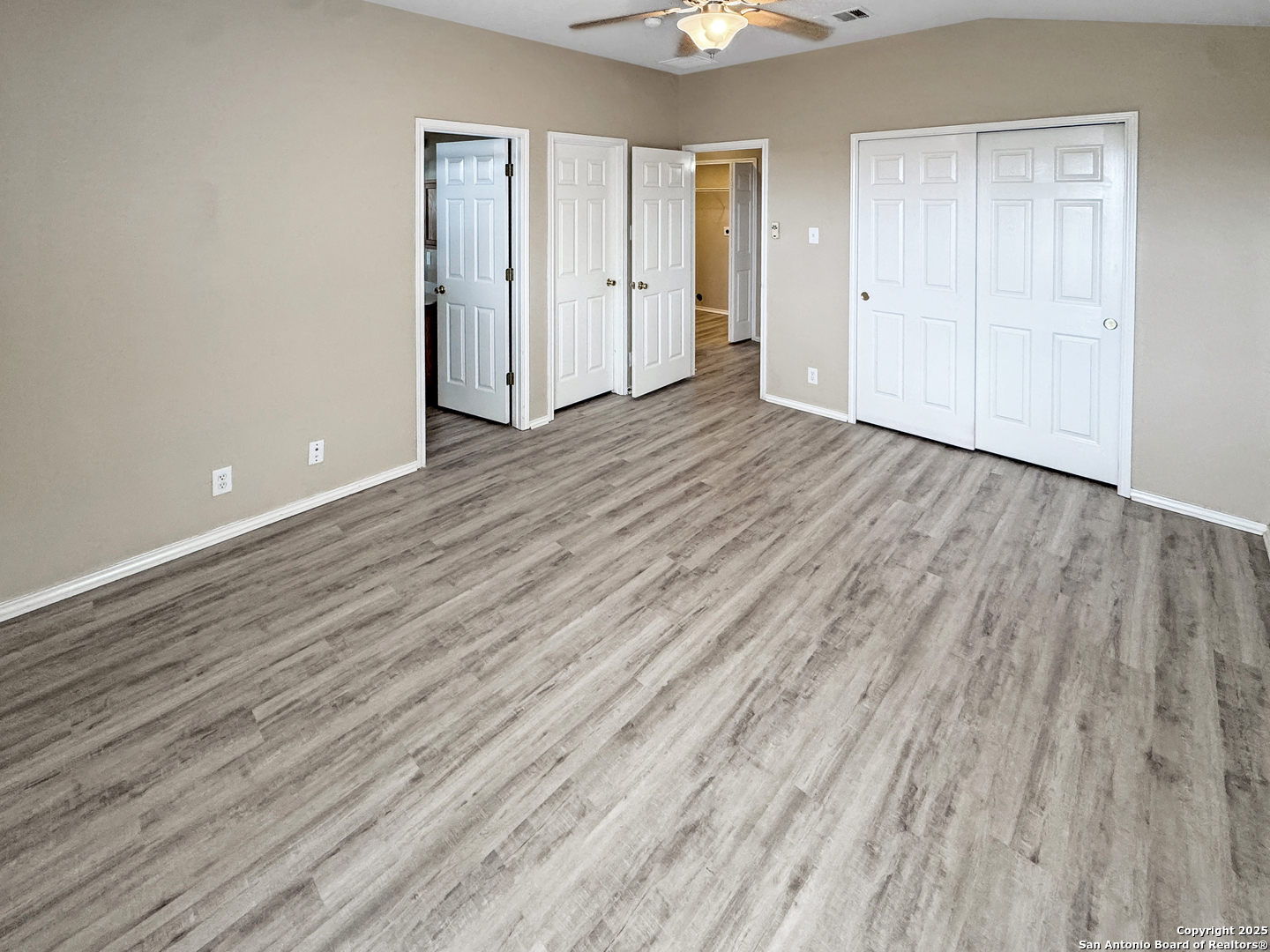 312 Hummingbird Drive New Braunfels, TX 78130 - Photo 13 of 20 a view of an empty room with wooden floor