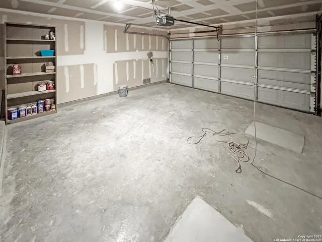 a view of a room with wooden floor and a window