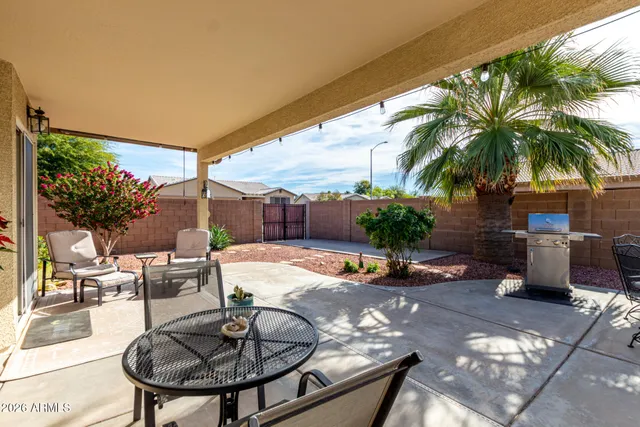 a swimming pool with outdoor seating