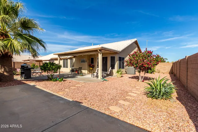a view of a backyard with a patio