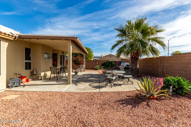a view of a house with outdoor space and sitting area