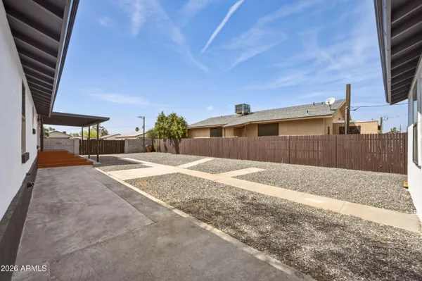 a view of a backyard of a house