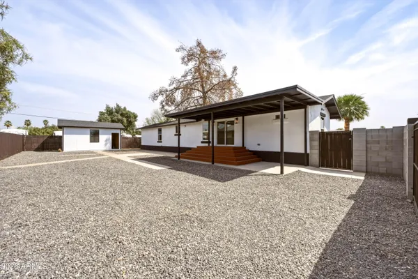 a house view with a backyard