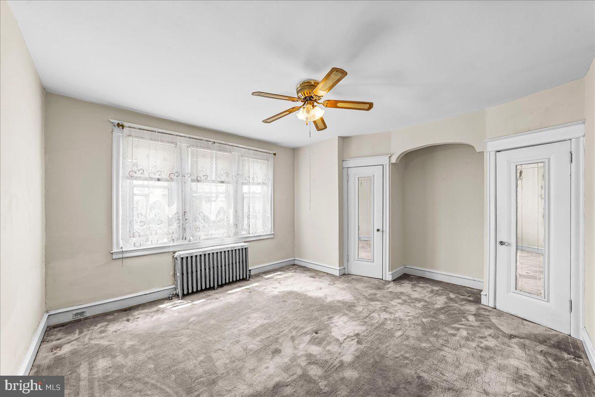 217 Avon Road Upper Darby, PA 19082 - Photo 10 of 16 a view of an empty room with a window