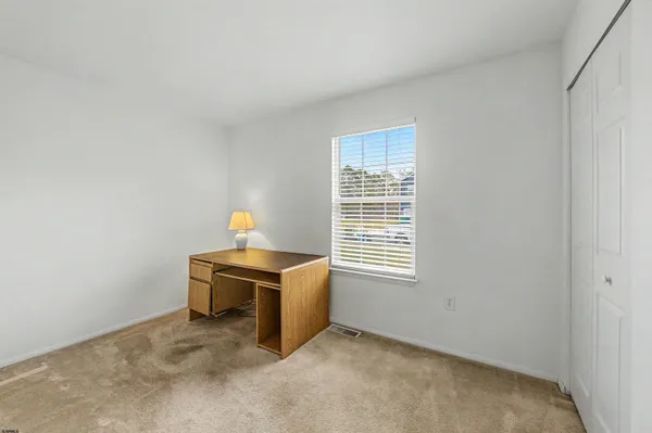 a workspace with furniture and a window