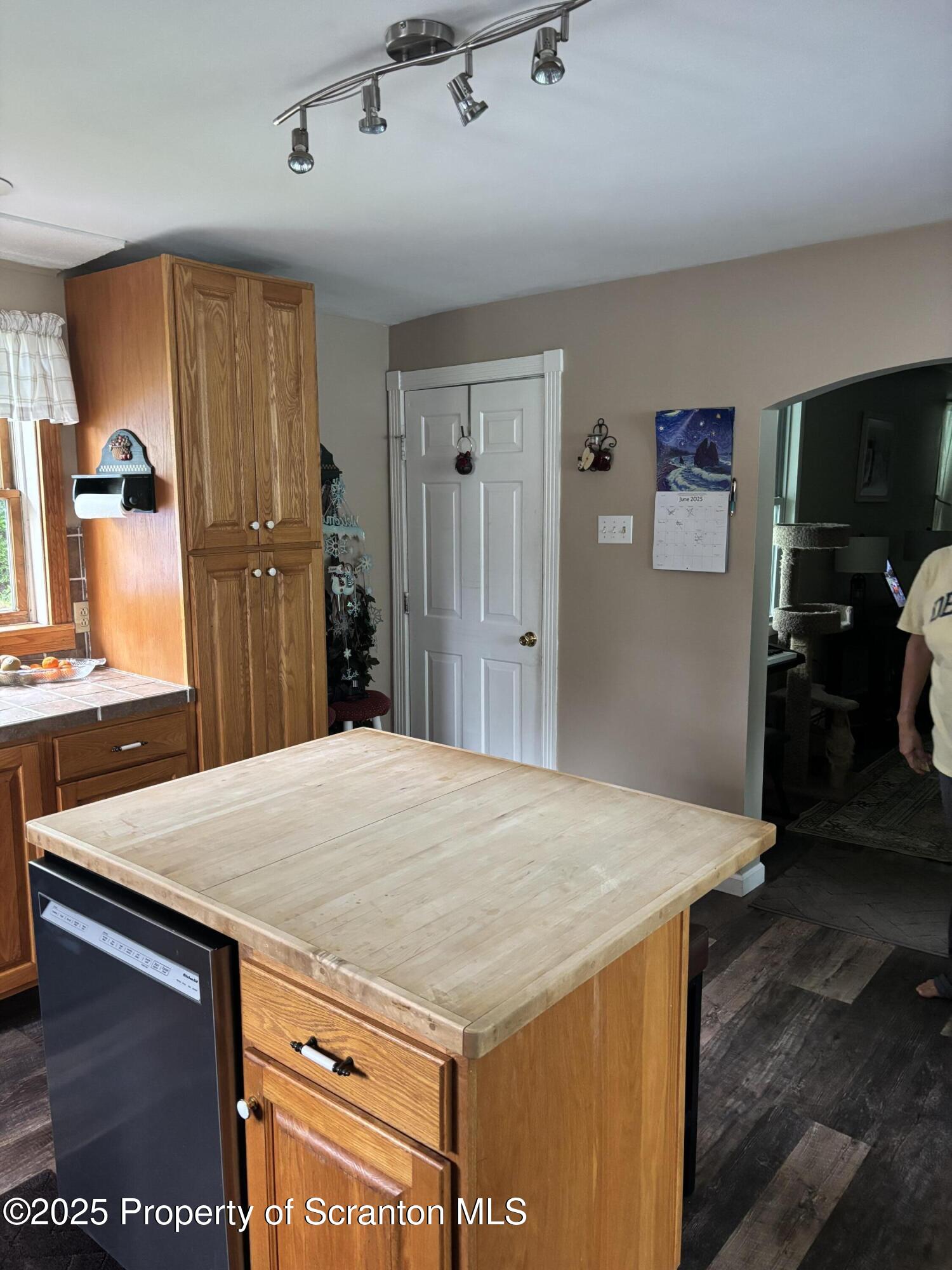 5036 Rear Birney Moosic, PA 18507 - Photo 19 of 35 a kitchen with a wooden floor and a refrigerator