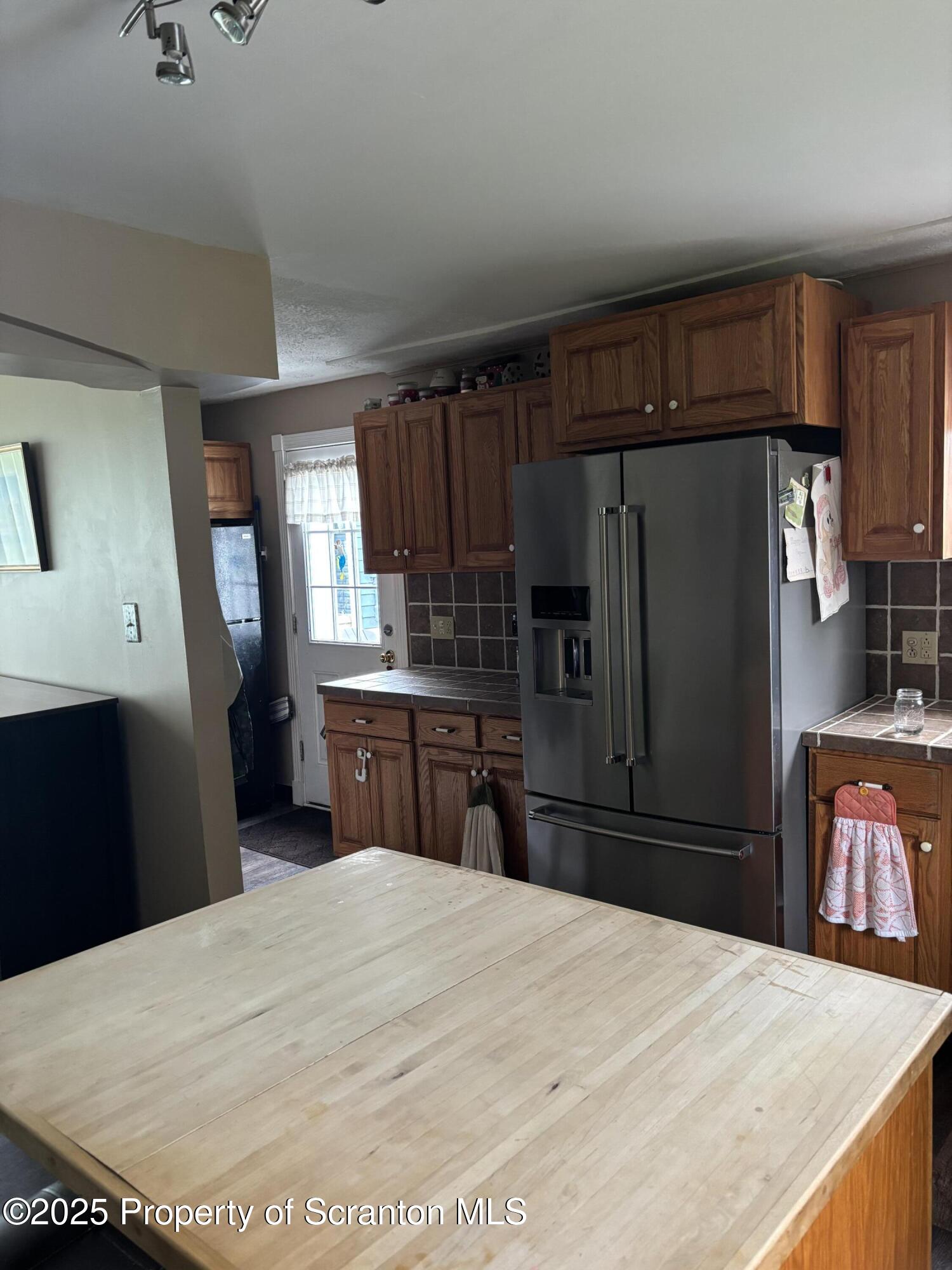 5036 Rear Birney Moosic, PA 18507 - Photo 20 of 35 a kitchen with granite countertop a refrigerator and a sink