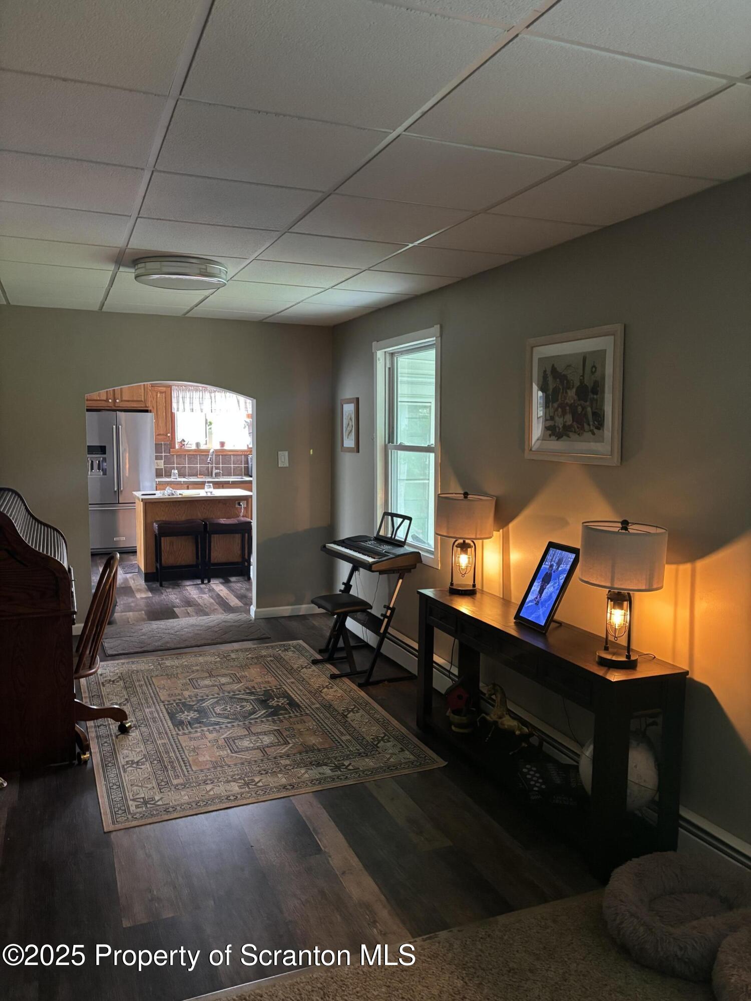 5036 Rear Birney Moosic, PA 18507 - Photo 26 of 35 a living room with furniture a flat screen tv and a fireplace