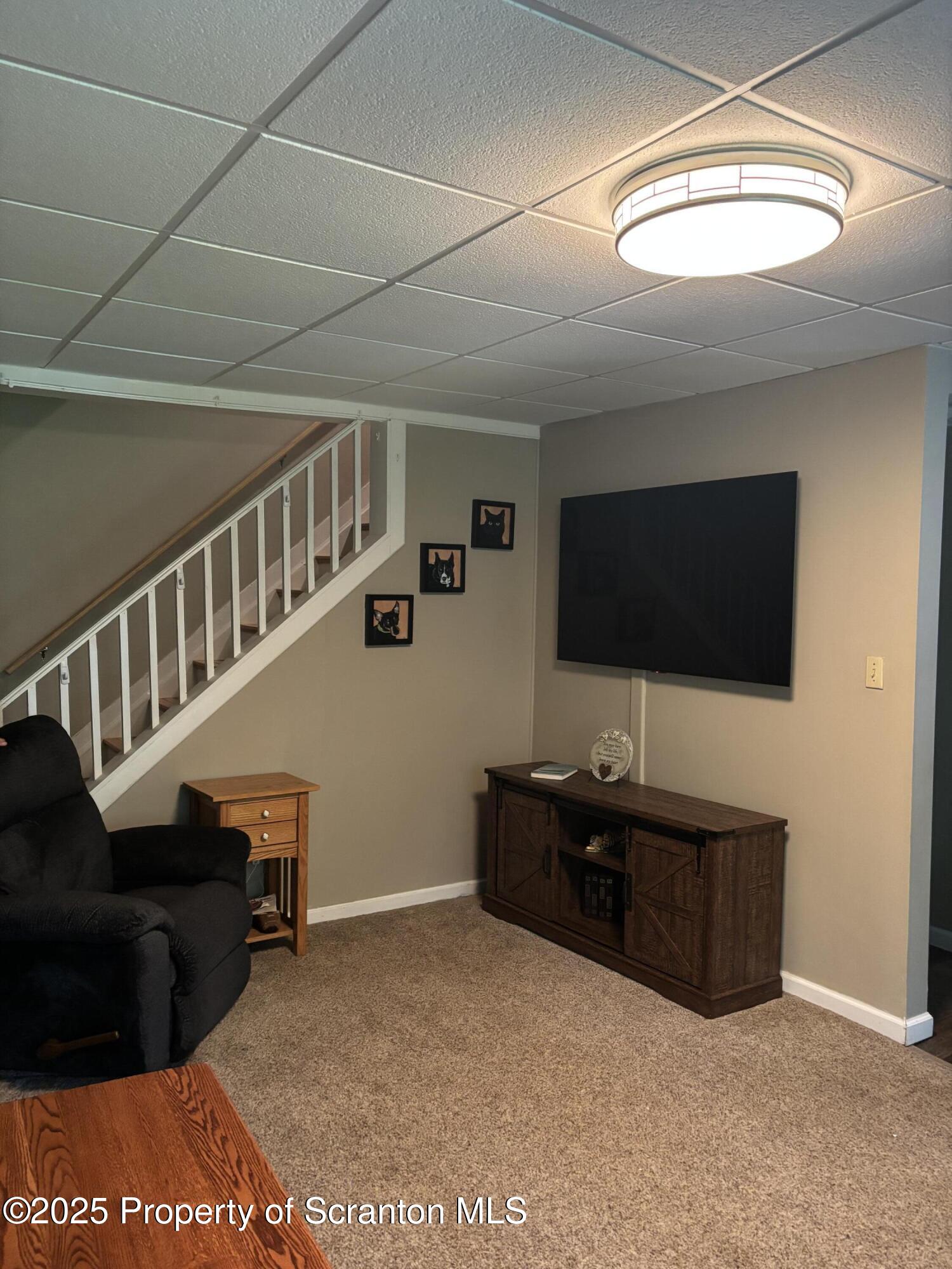 5036 Rear Birney Moosic, PA 18507 - Photo 27 of 35 a living room with furniture and a flat screen tv