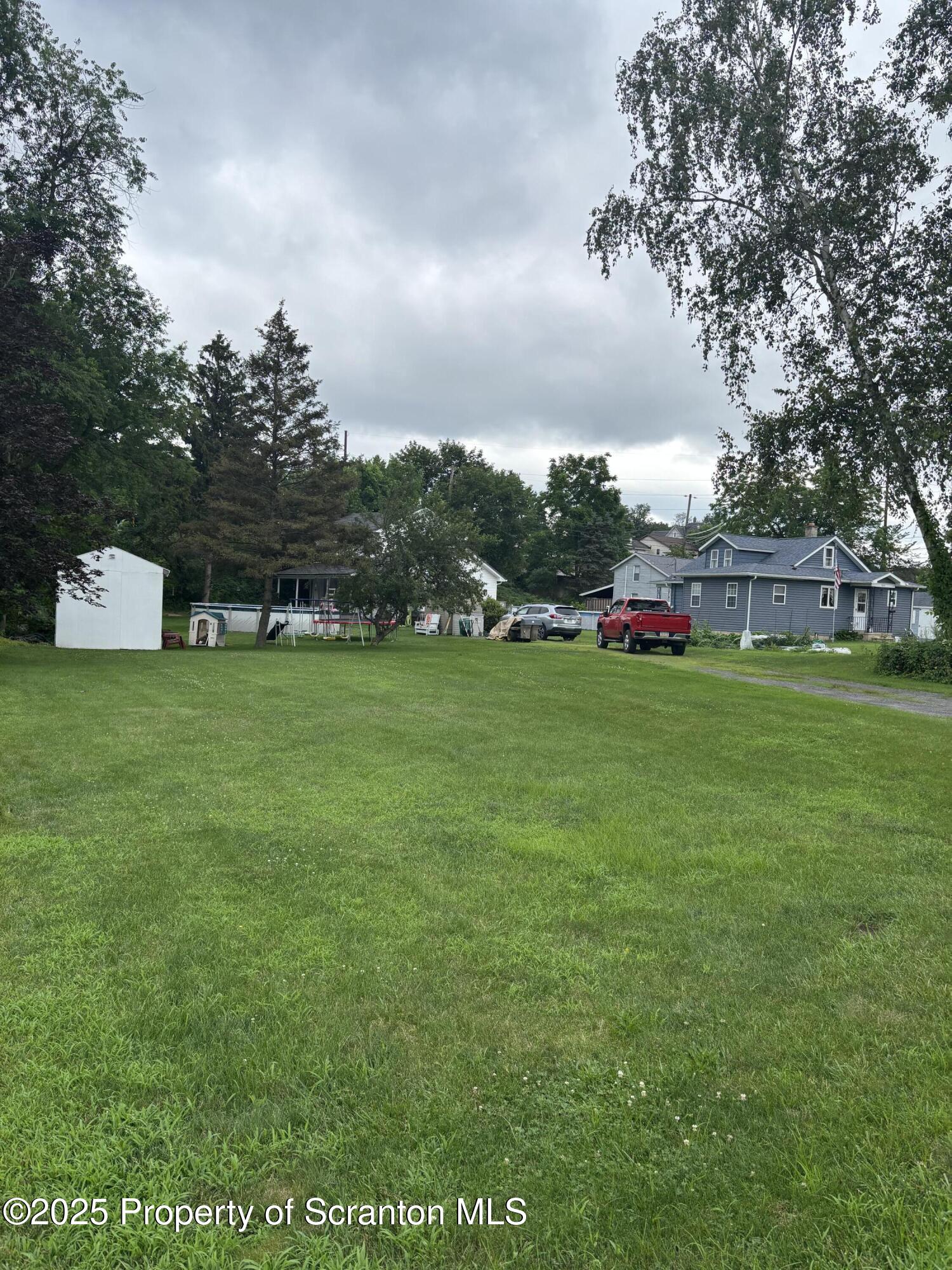 5036 Rear Birney Moosic, PA 18507 - Photo 3 of 35 a view of a field of grass and trees