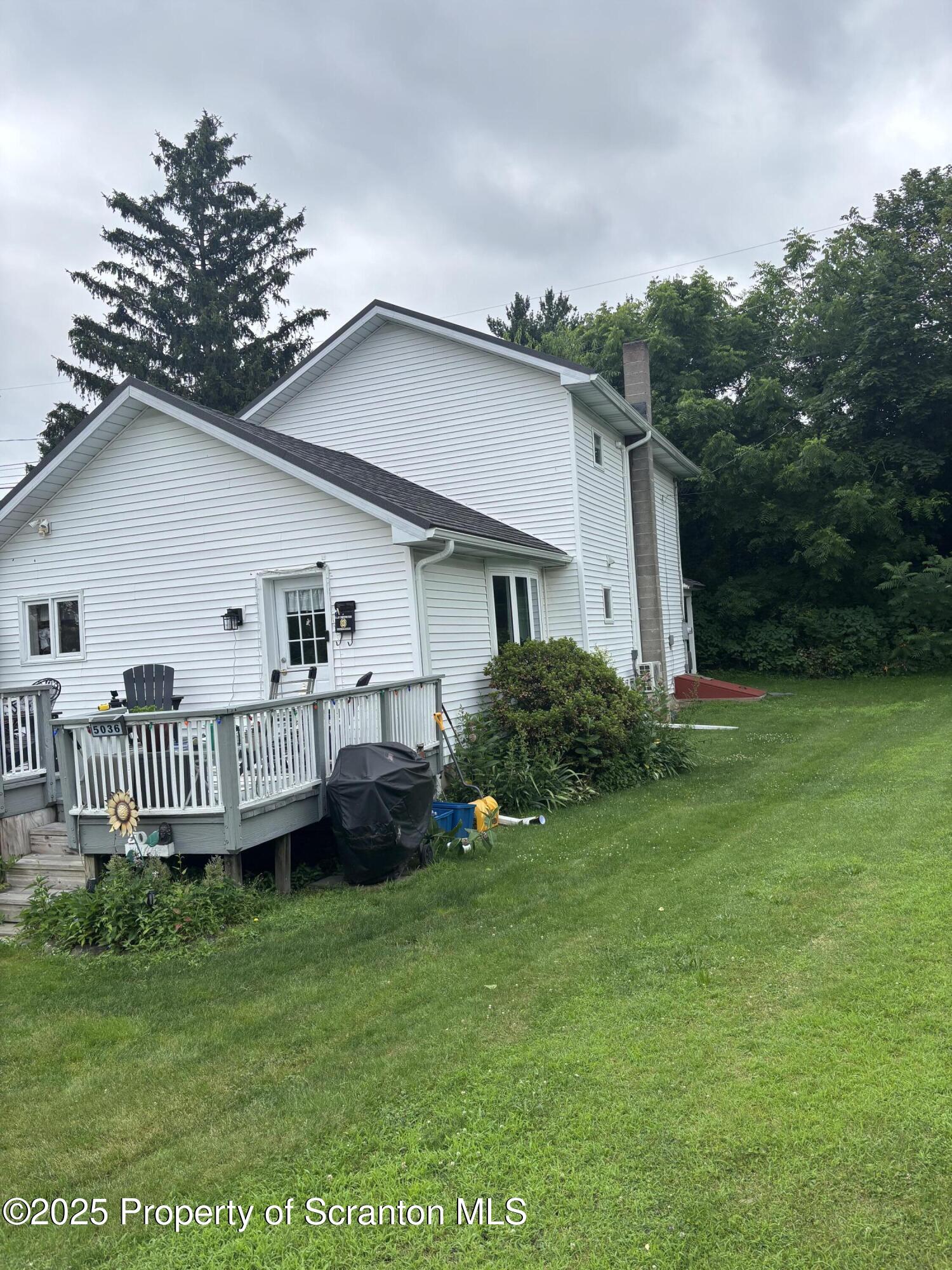 5036 Rear Birney Moosic, PA 18507 - Photo 10 of 35 a view of a house with a yard and deck