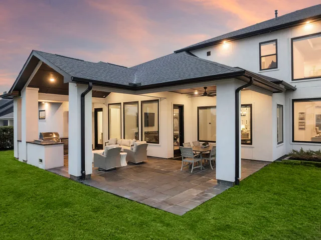 a view of an house with backyard porch and furniture