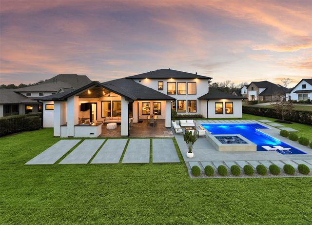 a front view of house with yard and outdoor seating
