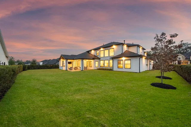 a view of a big house with a big yard