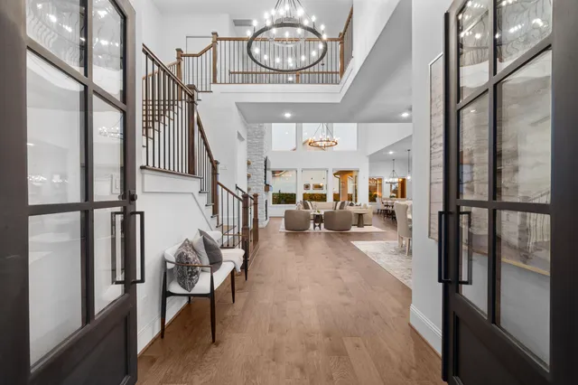 a view of entryway and hall with wooden floor