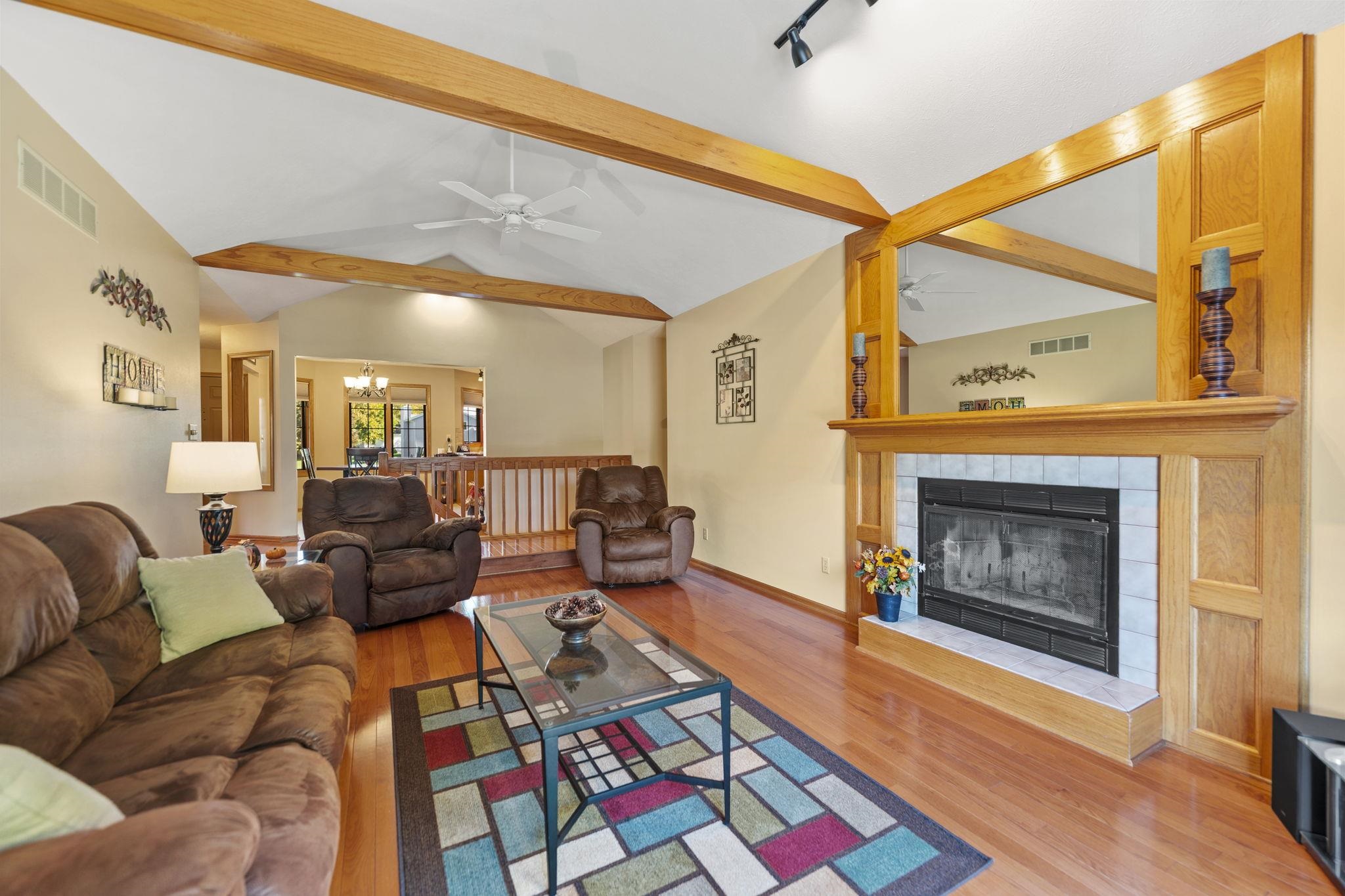 13546 Racoon Run Roscoe, IL 61073 - Photo 14 of 37 a living room with furniture a fireplace and a flat screen tv