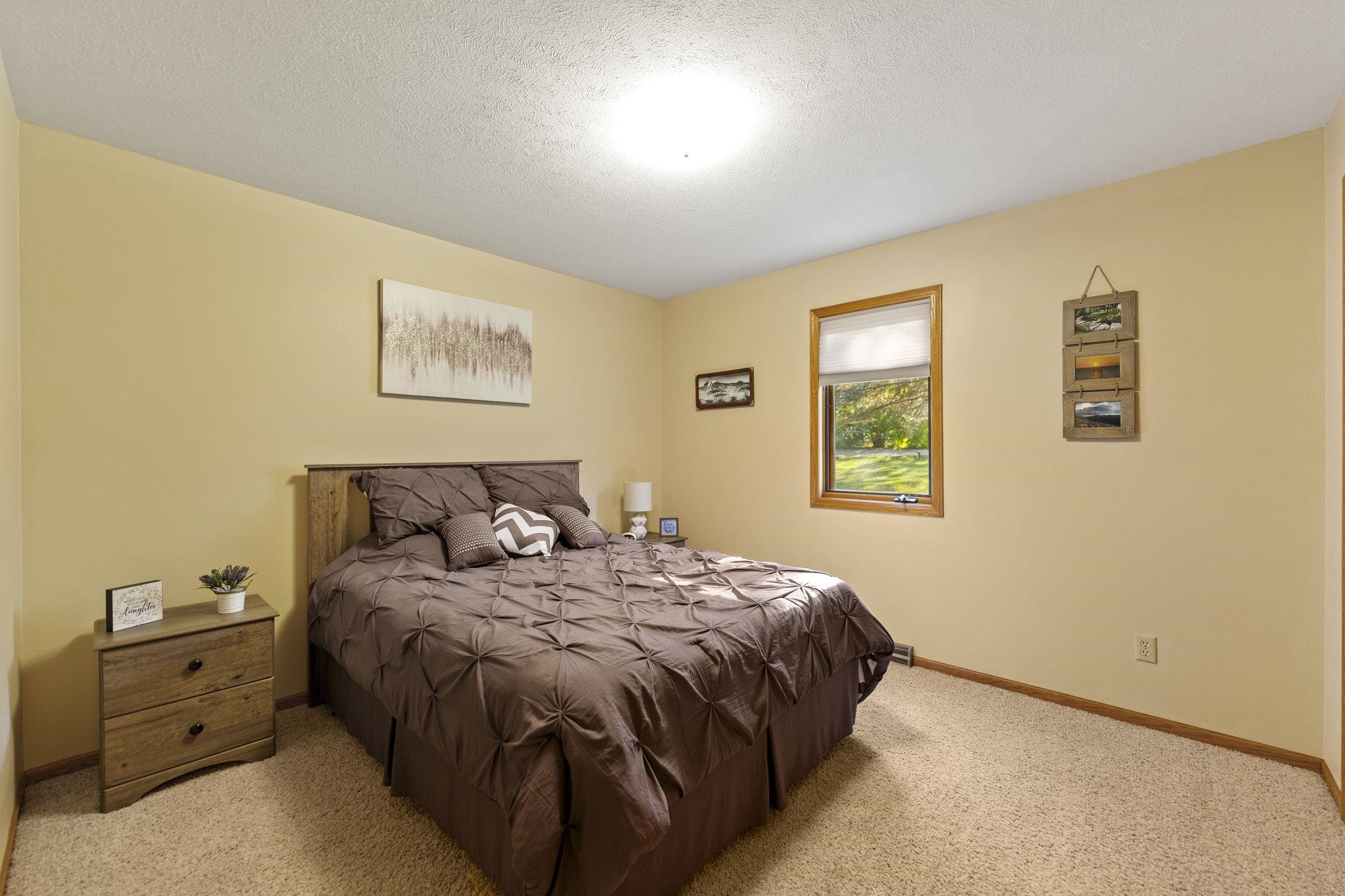 13546 Racoon Run Roscoe, IL 61073 - Photo 18 of 37 a bedroom with a bed and a window