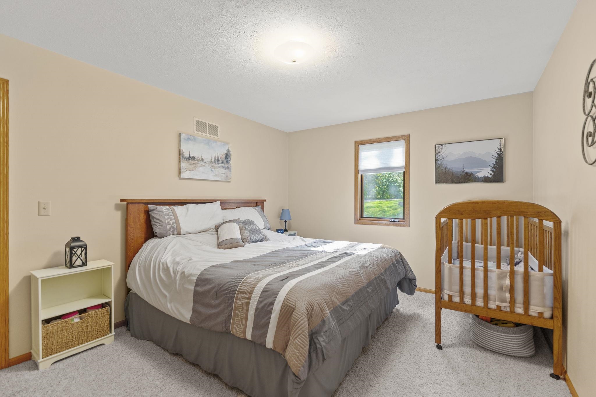 13546 Racoon Run Roscoe, IL 61073 - Photo 20 of 37 a bedroom with a bed and a window