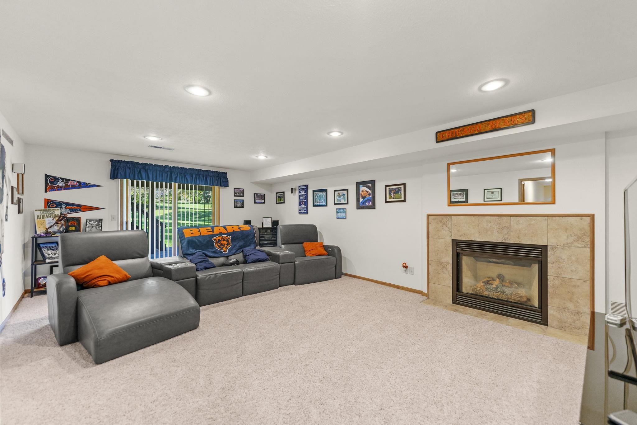 13546 Racoon Run Roscoe, IL 61073 - Photo 23 of 37 a living room with furniture and a fireplace