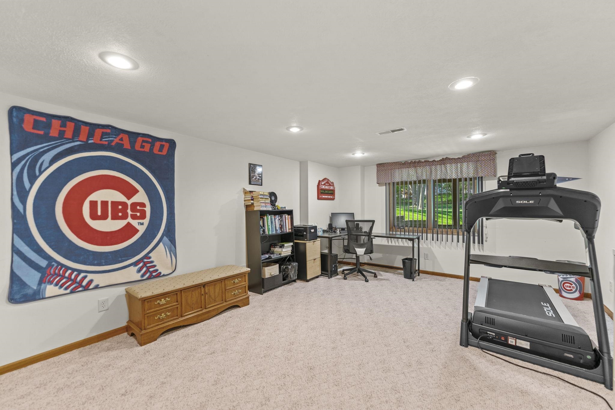 13546 Racoon Run Roscoe, IL 61073 - Photo 25 of 37 a living room with furniture a clock and a window