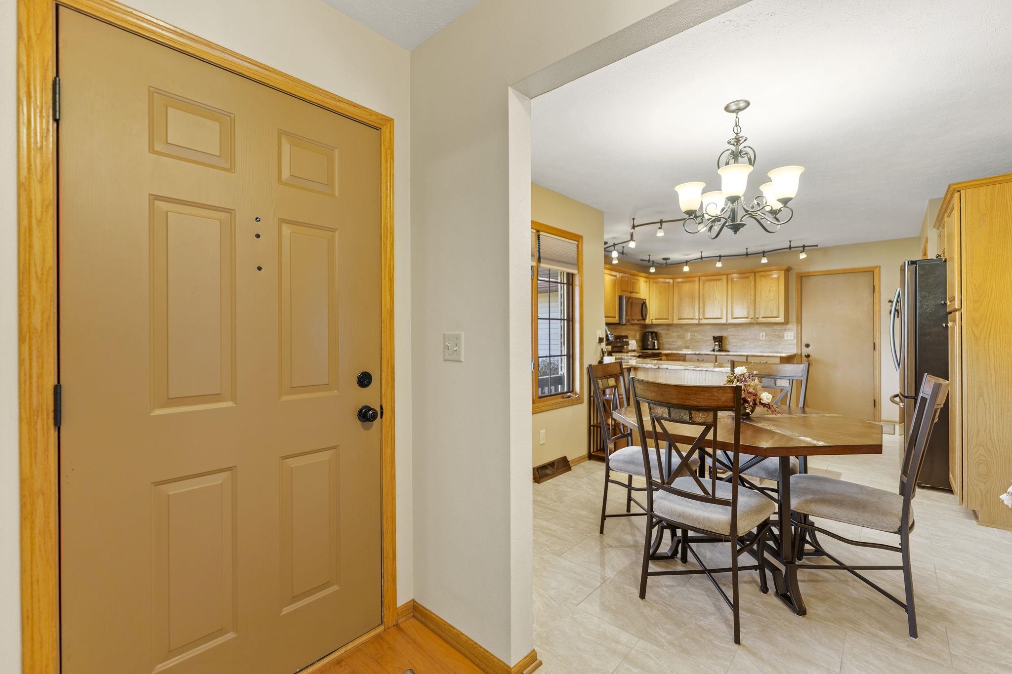 13546 Racoon Run Roscoe, IL 61073 - Photo 6 of 37 a dining room with furniture and chandelier kitchen view