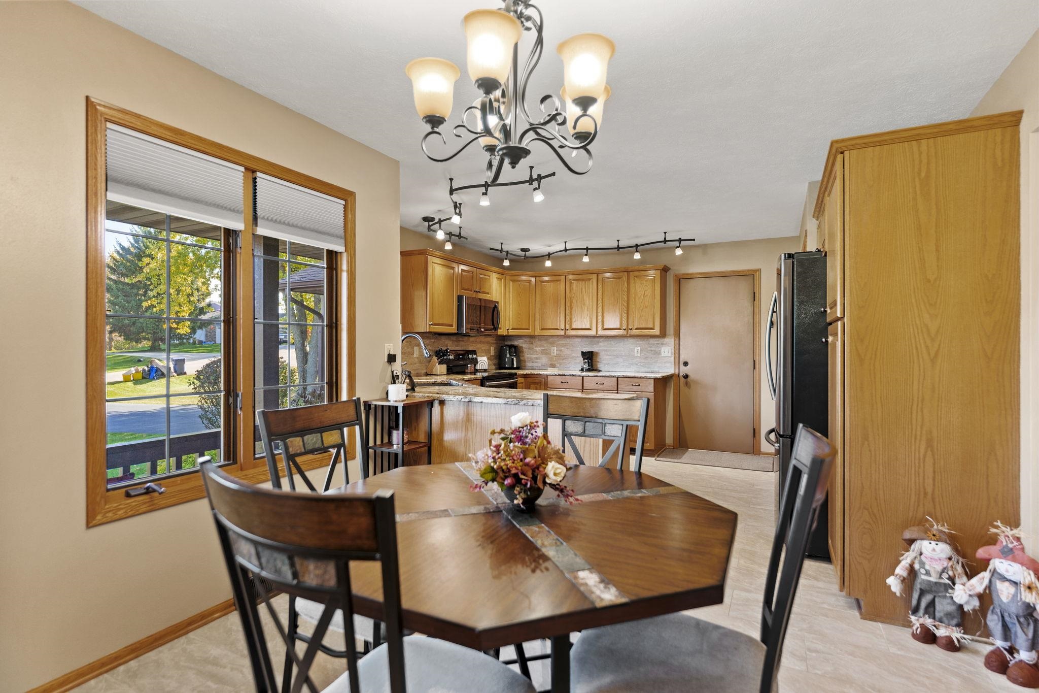 13546 Racoon Run Roscoe, IL 61073 - Photo 9 of 37 a view of a dining room with furniture window and outside view
