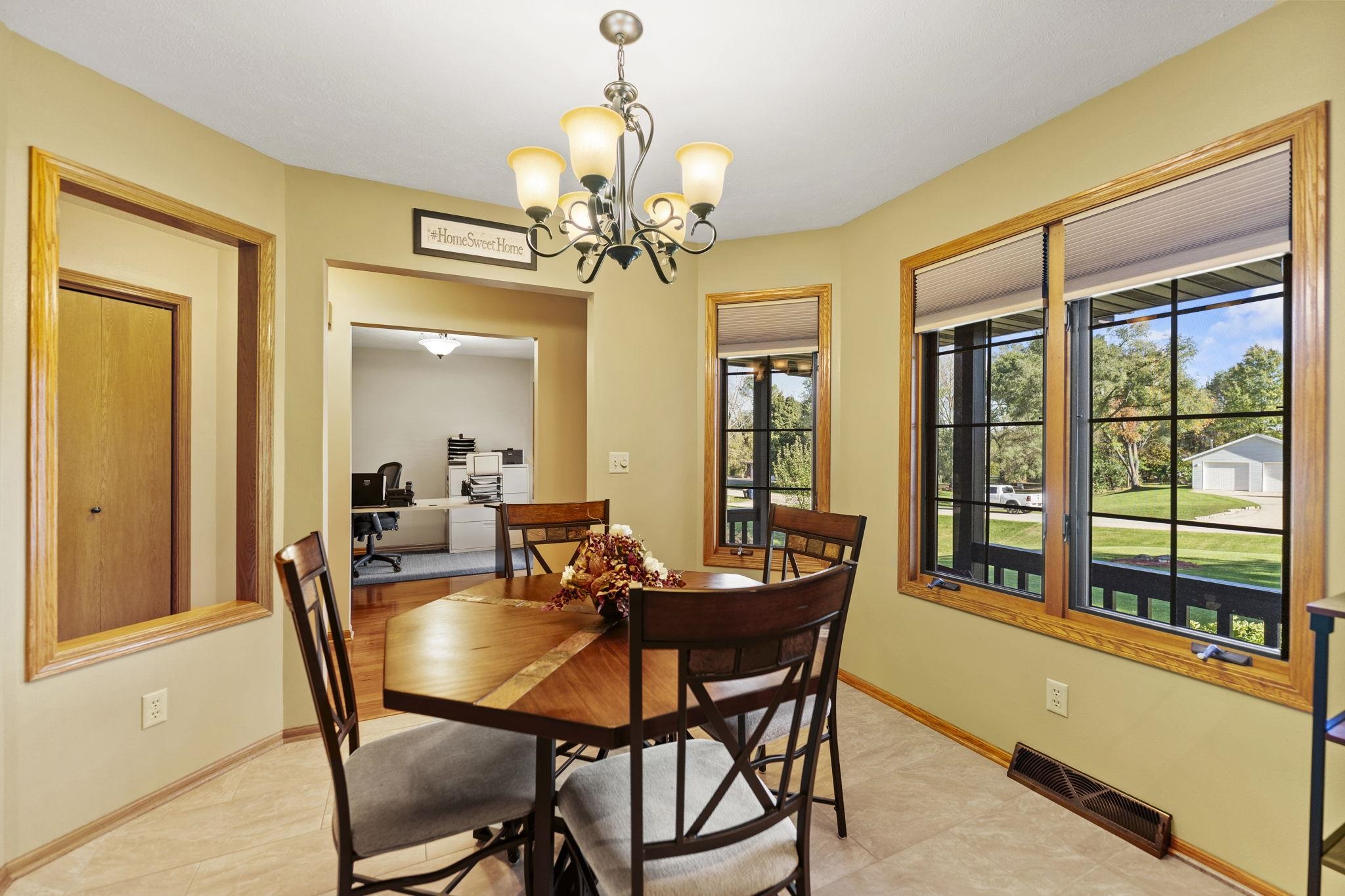 13546 Racoon Run Roscoe, IL 61073 - Photo 10 of 37 a dining room with furniture a livingroom and chandelier