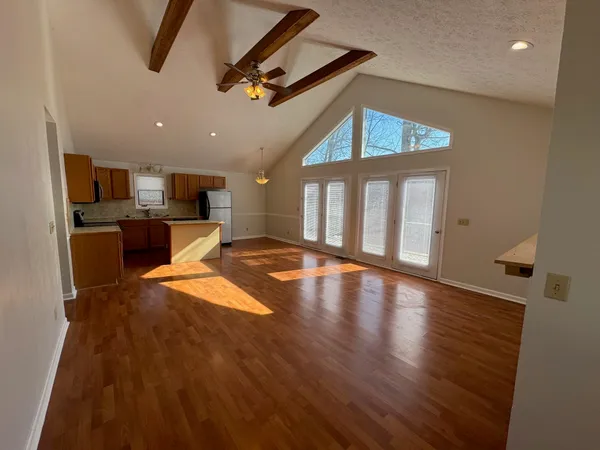 a view of a kitchen with a sink and a kitchen view