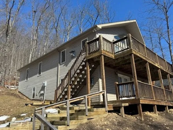 a front view of a house with a street