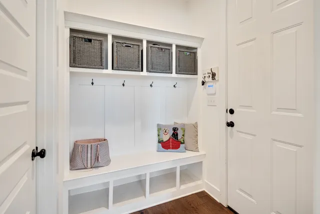 a large kitchen with a lot of counter space and wooden floor