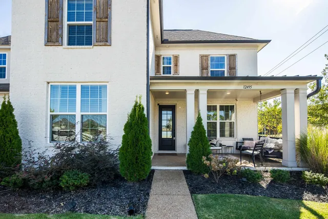 front view of a house with a yard