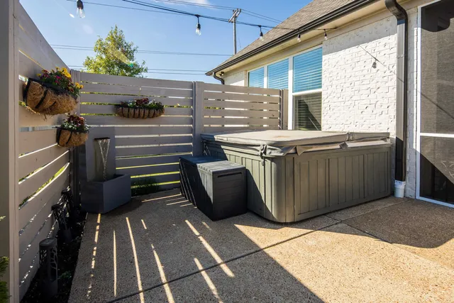 a patio with patio a couch and umbrella