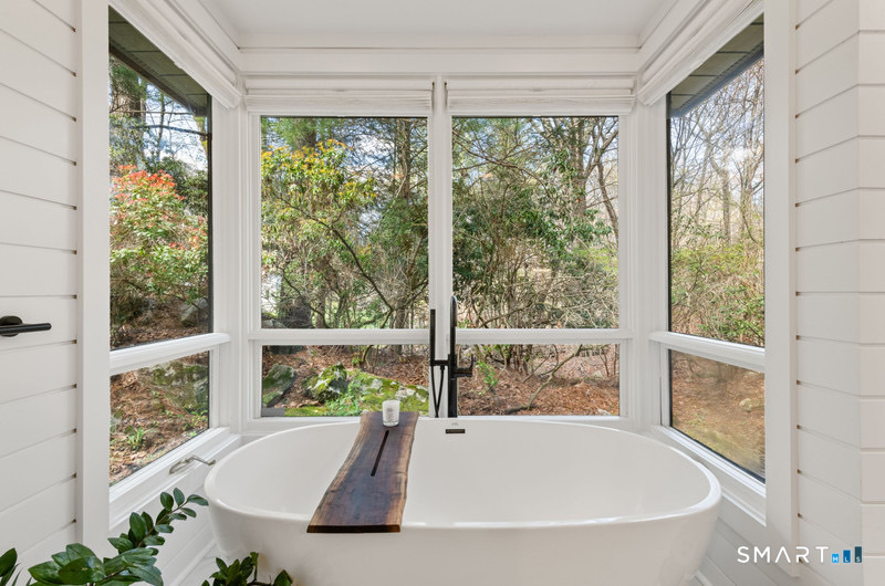 30 Catbrier Road Weston, CT 06883 - Photo 14 of 26 a bath tub sitting in front of a window