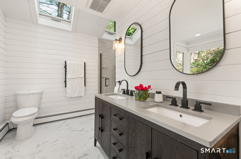30 Catbrier Road Weston, CT 06883 - Photo 15 of 26 a bathroom with a sink and a mirror
