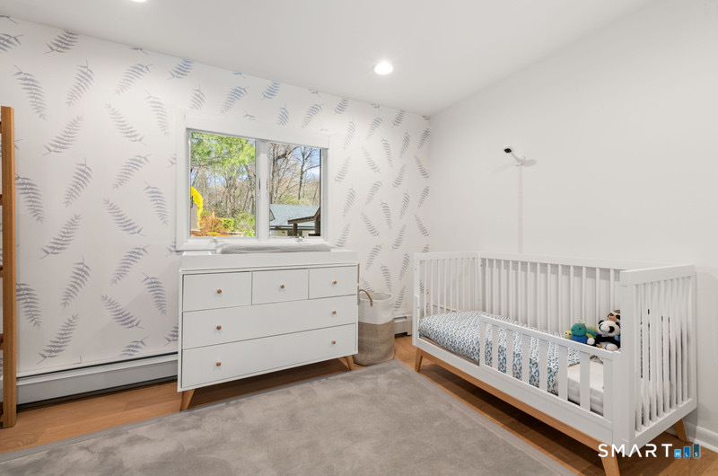 30 Catbrier Road Weston, CT 06883 - Photo 17 of 26 a bed room with a bed and a window