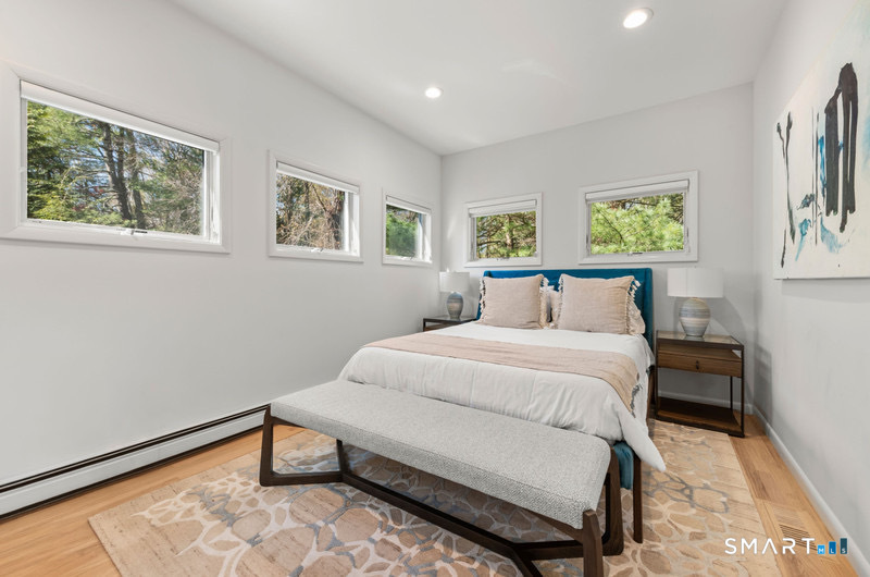 30 Catbrier Road Weston, CT 06883 - Photo 19 of 26 a bedroom with a bed and a window