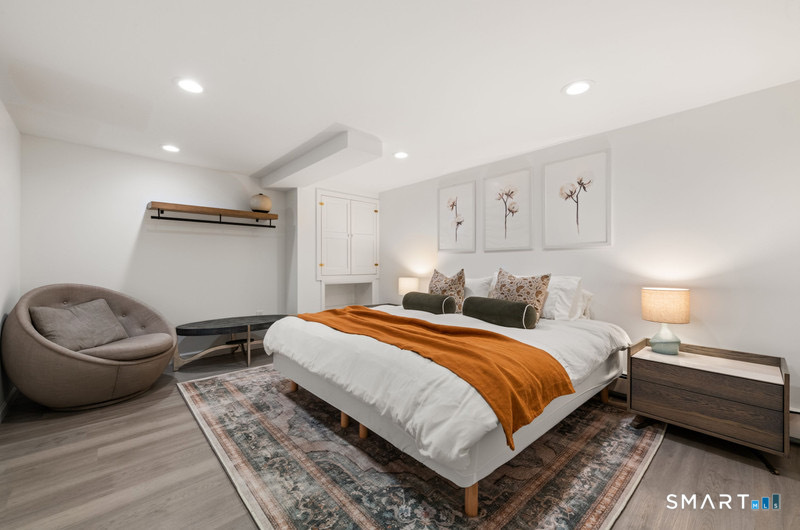 30 Catbrier Road Weston, CT 06883 - Photo 21 of 26 a bedroom with a bed and a couch