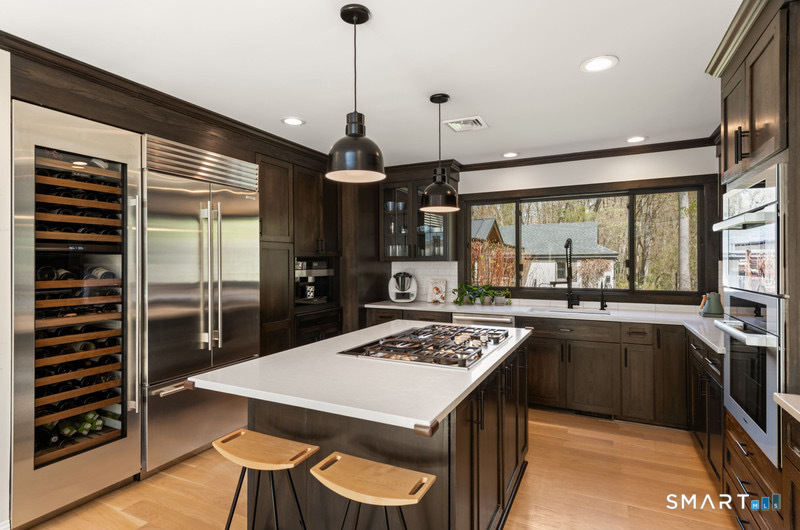30 Catbrier Road Weston, CT 06883 - Photo 7 of 26 a kitchen with a table and chairs in it