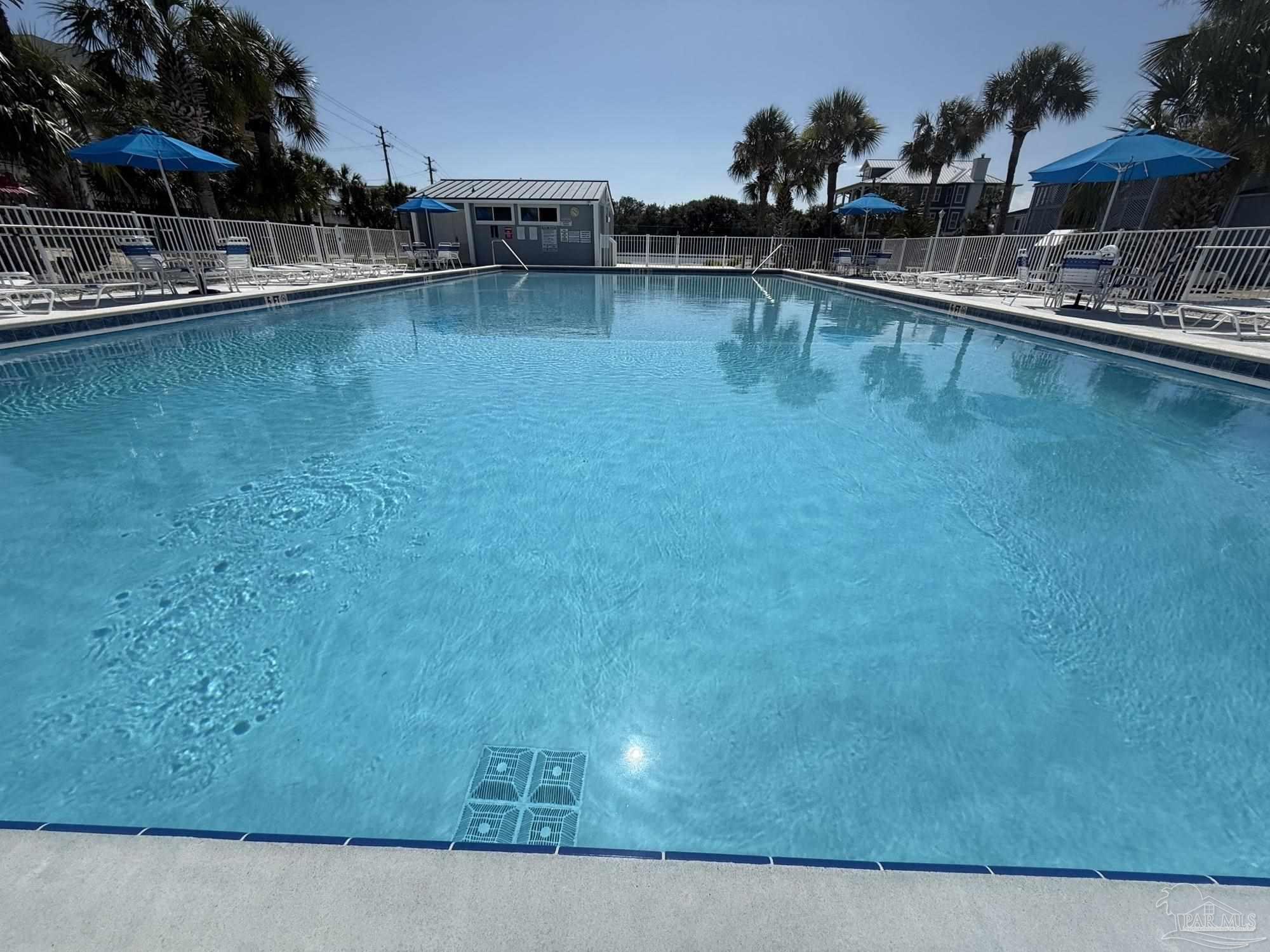16470 Perdido Key Drive, Unit B13 Perdido Key, FL 32507 - Photo 4 of 17 a swimming pool with outdoor seating and yard
