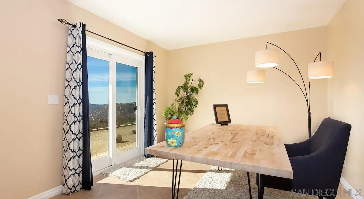 12951 Rancho Heights Road Pala, CA 92059 - Photo 21 of 41 a view of a living room with furniture and a potted plant