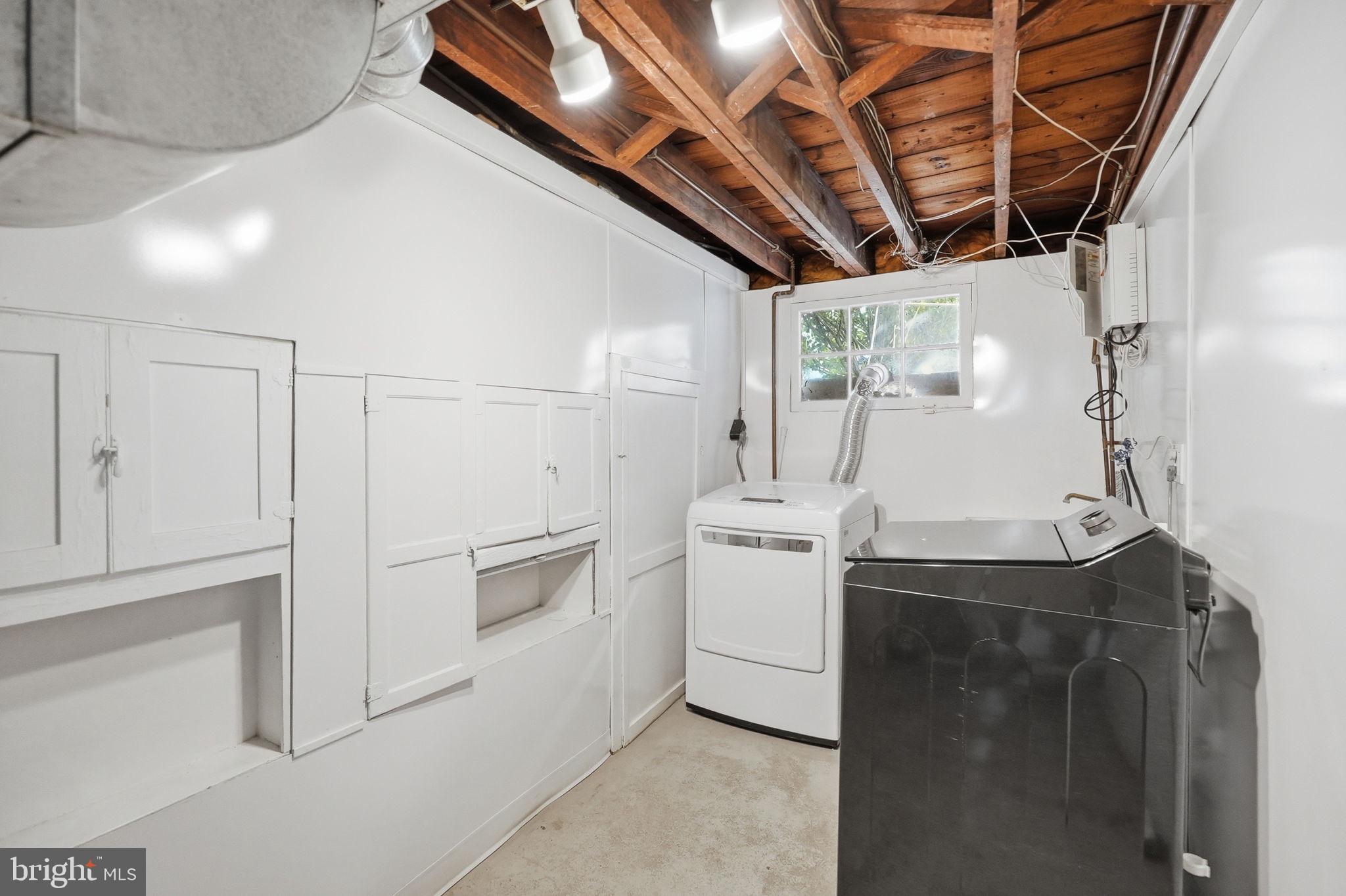 6814 Brookville Road Chevy Chase, MD 20815 - Photo 34 of 39 Bright and functional laundry space.