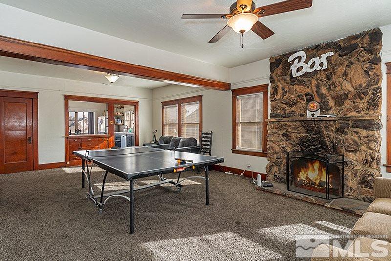 760 West Street Reno, NV 89503 - Photo 2 of 17 a living room with a table chairs and a fireplace