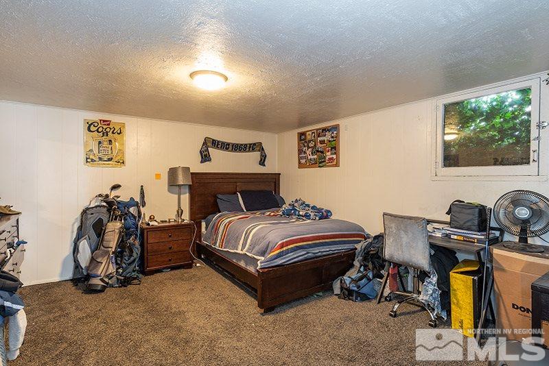 760 West Street Reno, NV 89503 - Photo 9 of 17 a bedroom with bed and a flat tv screen