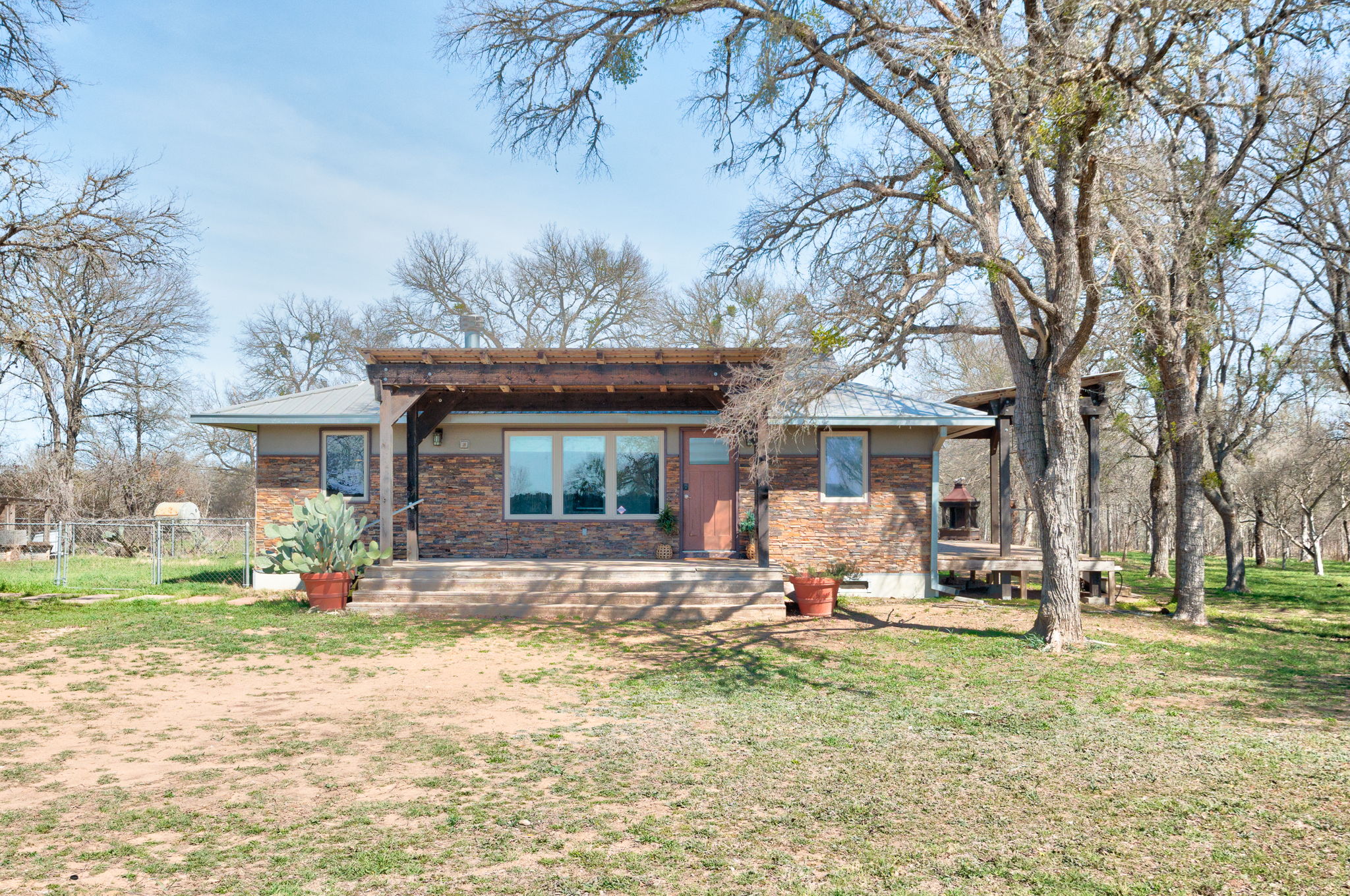 Bungalow featuring a patio area